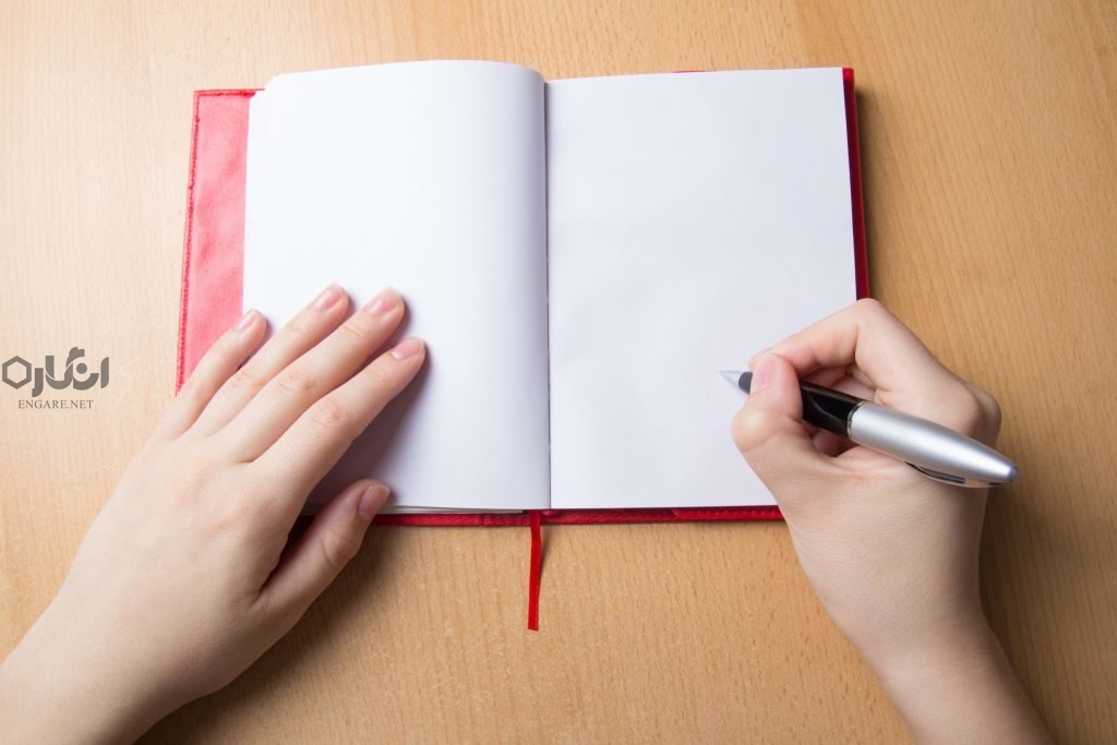 girl hand writing in notebook